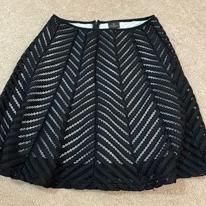 Black skirt with white underlay. Size 4 petite